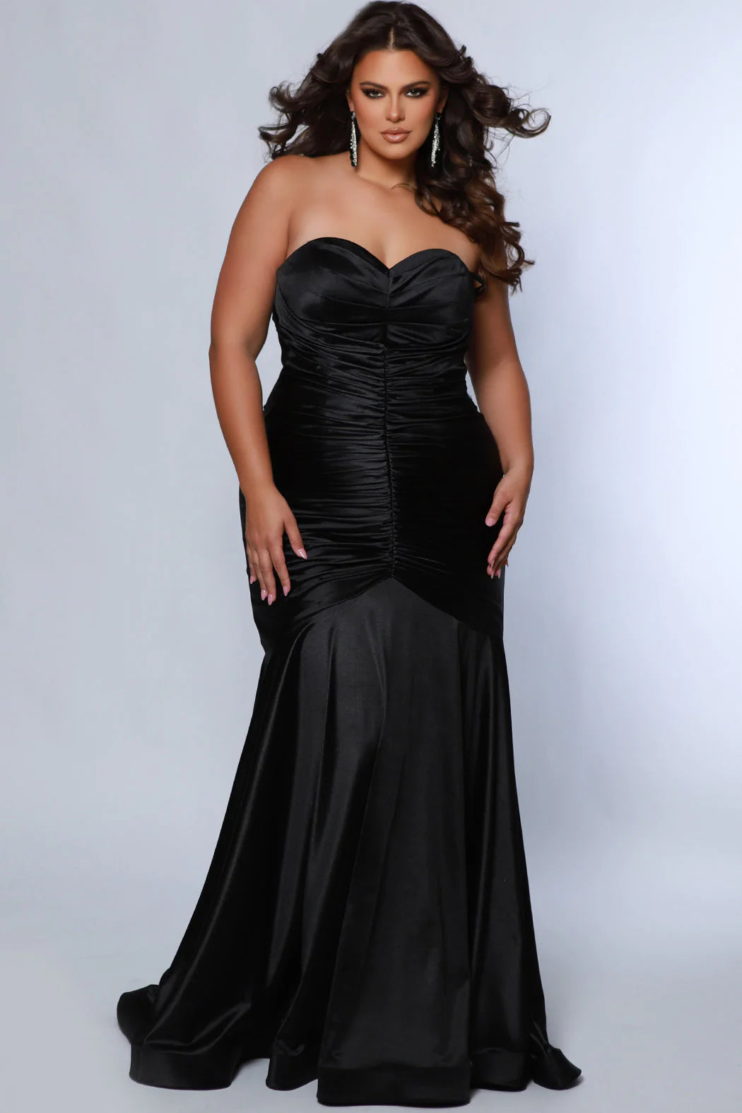 This elegant mermaid dress by Sydneys Closet SC7364 features a fitted sweetheart bodice top and a ruched satin skirt with a long, floor-length train. With a timeless strapless design, this prom dress is perfect for a formal occasion. Our curve-hugging long formal dress lets you look glamorous and make a trendy fashion statement at Prom or any elegant evening event coming up on your social calendar.