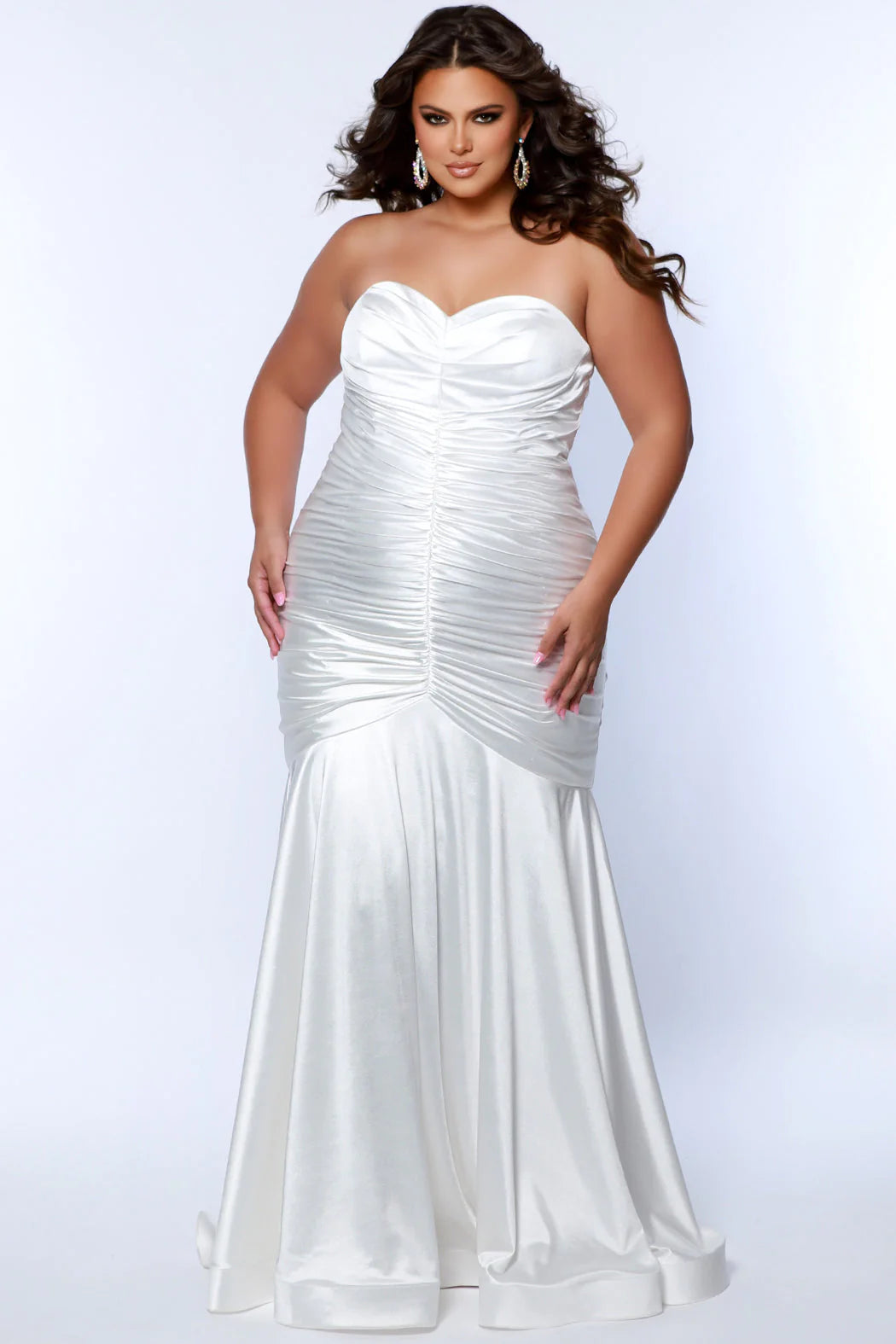 This elegant mermaid dress by Sydneys Closet SC7364 features a fitted sweetheart bodice top and a ruched satin skirt with a long, floor-length train. With a timeless strapless design, this prom dress is perfect for a formal occasion. Our curve-hugging long formal dress lets you look glamorous and make a trendy fashion statement at Prom or any elegant evening event coming up on your social calendar.