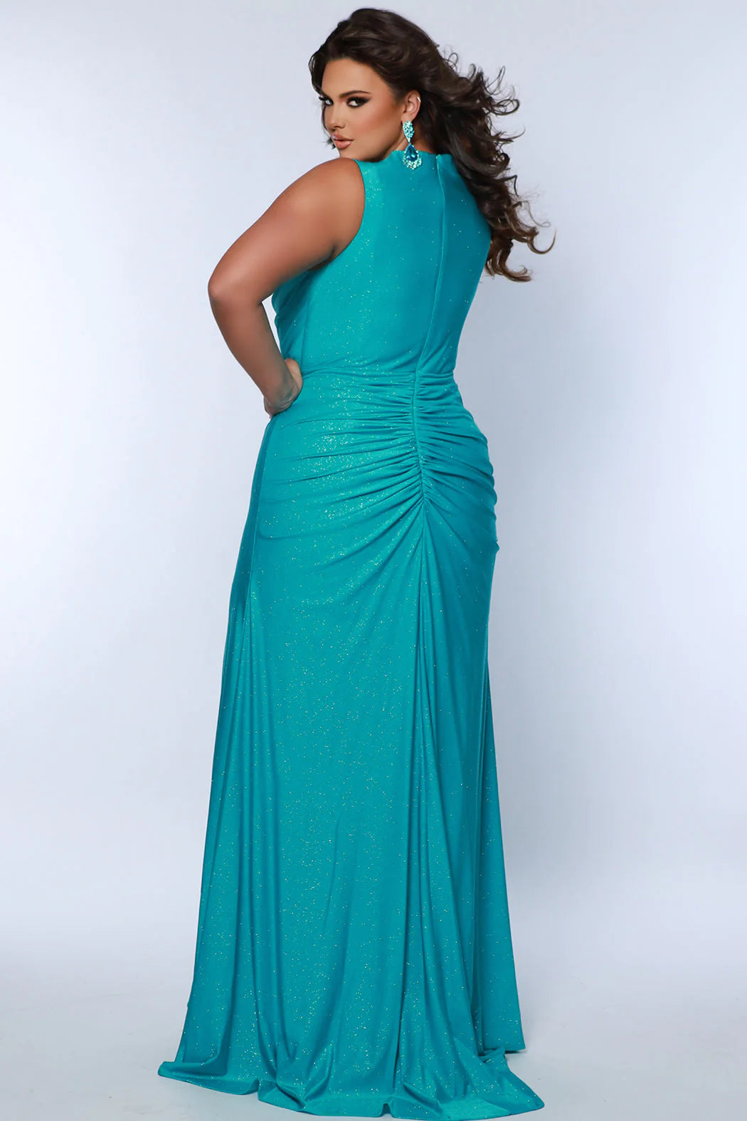 This Sydneys Closet SC7369 Plus Size Prom Dress will make you look amazing at your formal event. It features a stunning V neckline, with an elegant ruched back and a slit train. The fabric is comfortable and the slim fit is designed to flatter curves. Make a lasting impression at your special event! 