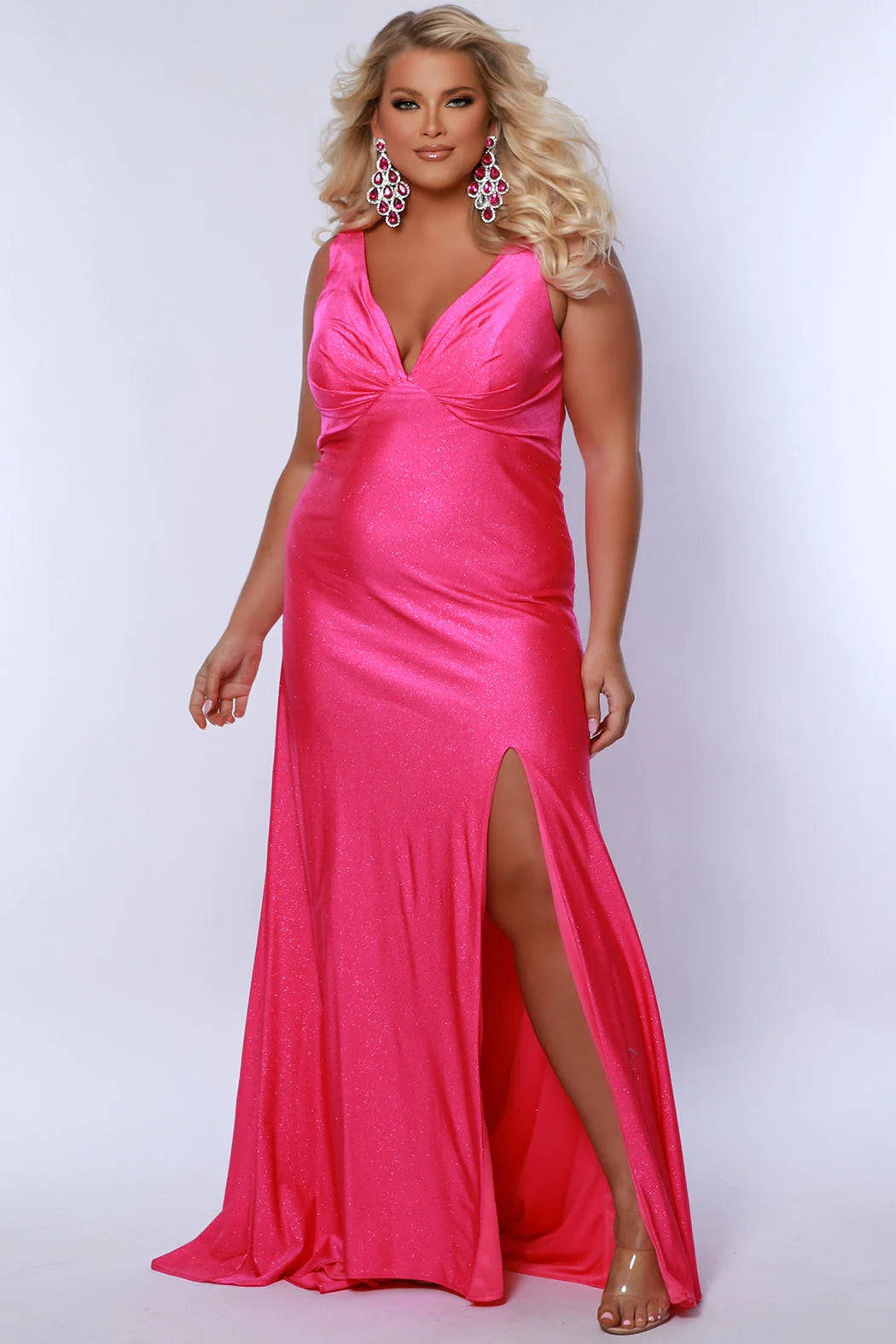 This Sydneys Closet SC7369 Plus Size Prom Dress will make you look amazing at your formal event. It features a stunning V neckline, with an elegant ruched back and a slit train. The fabric is comfortable and the slim fit is designed to flatter curves. Make a lasting impression at your special event! 