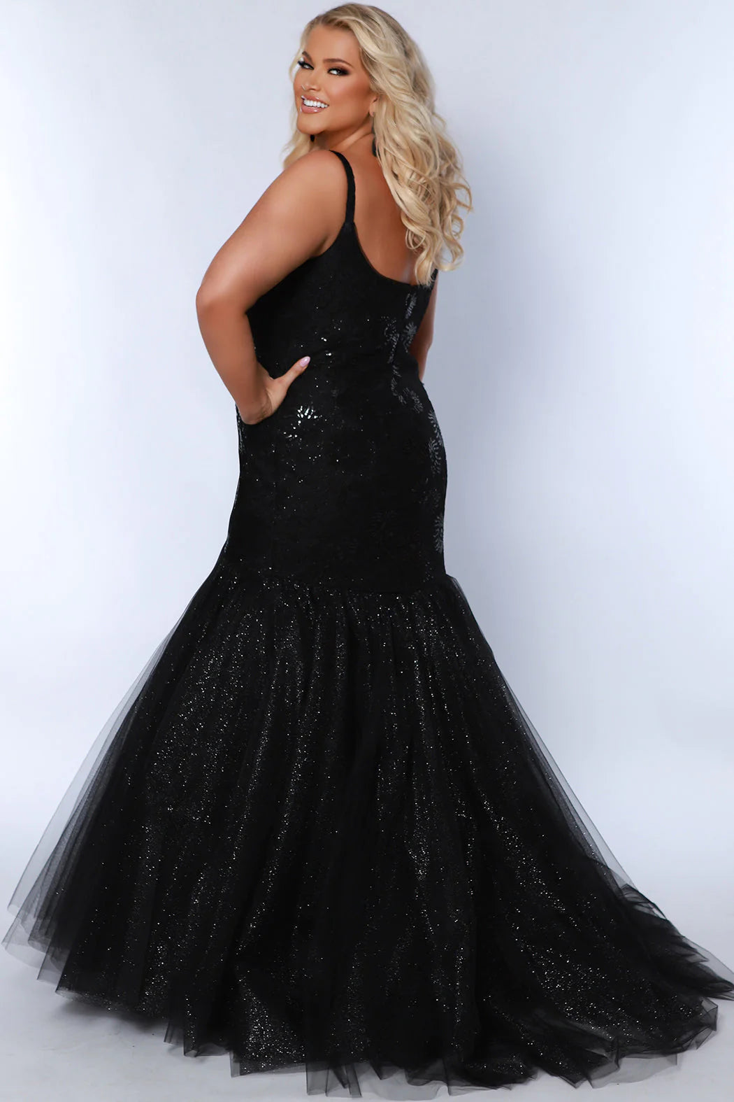 Sydneys Closet's SC7370 Prom Dress is a stunning gown perfect for any formal event. Its mermaid silhouette provides a fitted design with a beautiful scoop neck, perfect for showcasing your style. Crafted from luxurious fabric, it ensures a comfortable and flattering fit for plus size figures.