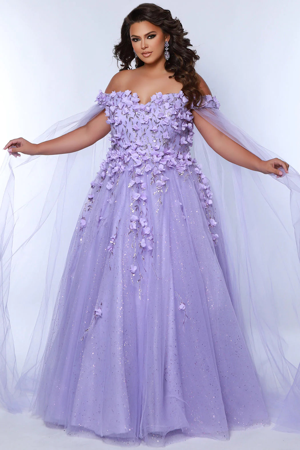 This glamorous Sydneys Closets SC7379 prom dress features an off-shoulder, sweetheart neckline and a fitted silhouette adorned with 3D floral details. The elegant design is perfect for a formal occasion such as a prom, pageant, or wedding. Plus size options are available for an ideal fit. Look and feel  like royalty at Prom 2024 or any formal ball when you opt to be lady who wears our "Dream On" gown.