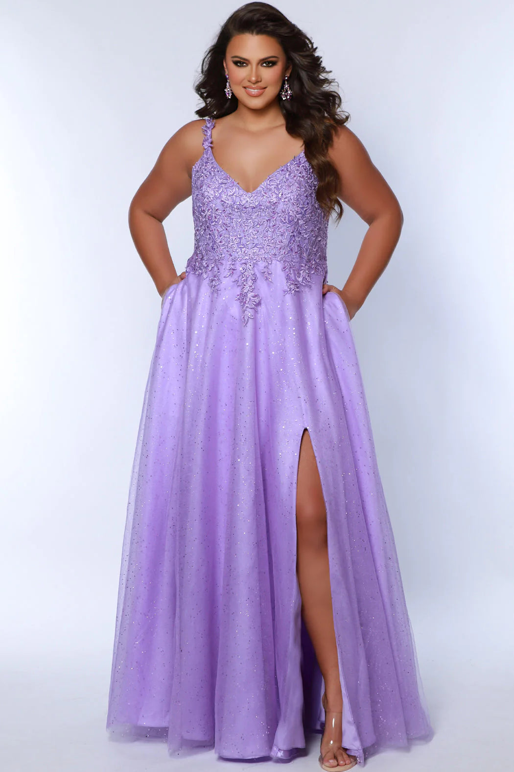 Look stunning at any formal event in a Sydneys Closet SC7384 Long Prom Dress. This A-line prom gown features a V-neckline with a scoop back, slit, pockets and a floor-length skirt complete the look. Ideal for plus size formal occasions. Pump up the fun factor at Prom 2024 when you arrive wearing this sparkly Aline evening dress. 