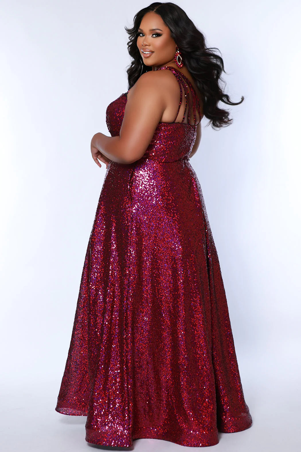 Elevate your look in Sydneys Closet SC7389 Long Prom Dress. This plus size sequin gown features an off-shoulder neckline, A-line silhouette, and pockets for added convenience. Perfect for formal occasions, this dress ensures you'll make a stunning entrance. Be the glamour Queen at Prom 2024 or any formal gala when you sparkle in our 1-shoulder sequin plus size evening dress. 