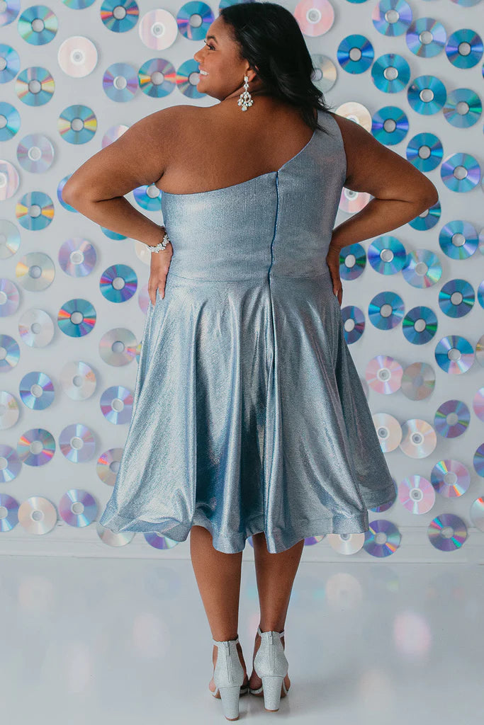 Sydney's Closet SC8119 A-Line One Shoulder Strap Satin Holographic Fabric With Pockets Short Plus Size Homecoming Dress. It's time to shine like a diamond in Sydney's Closet SC8119 A-Line One Shoulder Strap Satin Holographic Fabric With Pockets Short Plus Size Homecoming Dress! Boasting a luxe satin fabric, holographic detailing, and one shoulder strap, you'll be making a statement like never before! Plus, the pockets add a touch of practicality to your flashy evening look!