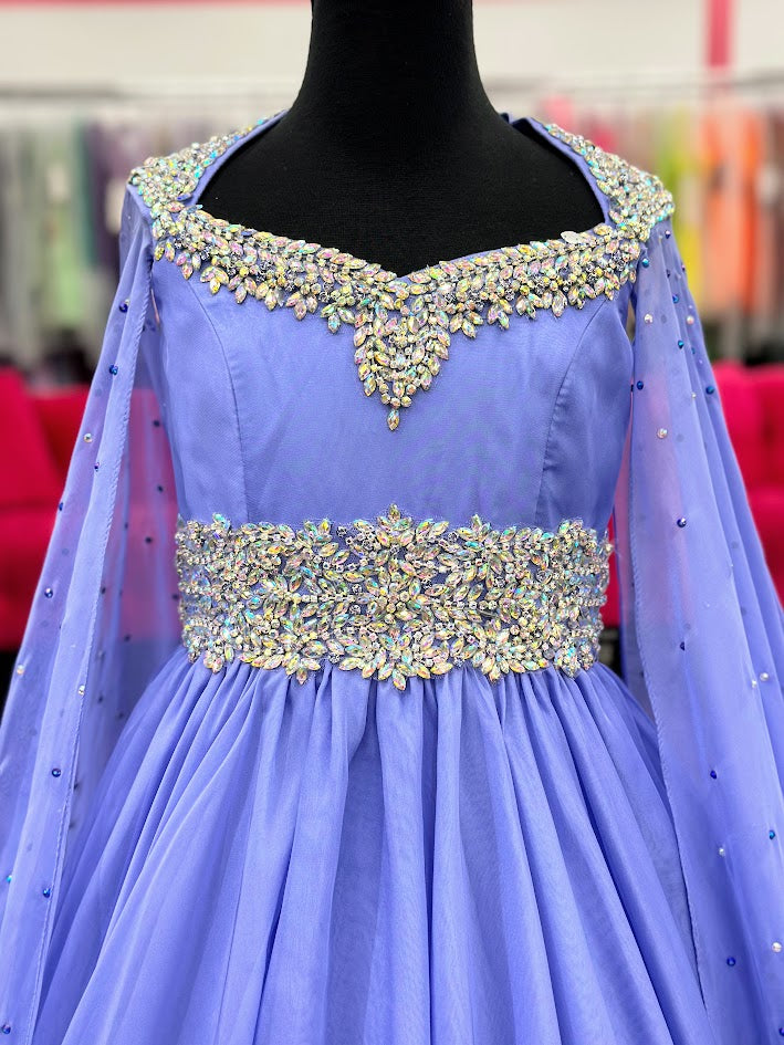 The Samantha Blake 1023 Girls Long Cape Sleeve Pageant Dress is perfect for any special occasion. The crystal cut out back and A line silhouette add a touch of elegance to the chiffon material. With long cape sleeves flowing from a cap sleeve, your child will feel like a true princess in this beautiful dress. Perfect Unique look for Pageants!