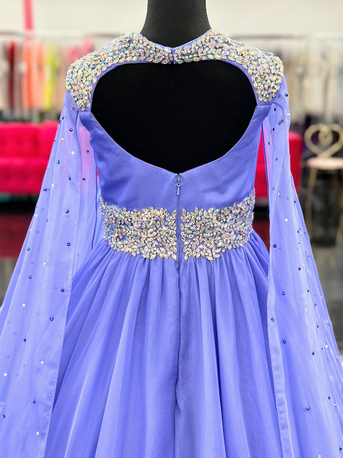 The Samantha Blake 1023 Girls Long Cape Sleeve Pageant Dress is perfect for any special occasion. The crystal cut out back and A line silhouette add a touch of elegance to the chiffon material. With long cape sleeves flowing from a cap sleeve, your child will feel like a true princess in this beautiful dress. Perfect Unique look for Pageants!