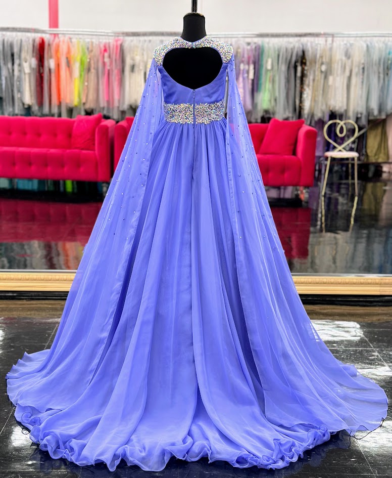 The Samantha Blake 1023 Girls Long Cape Sleeve Pageant Dress is perfect for any special occasion. The crystal cut out back and A line silhouette add a touch of elegance to the chiffon material. With long cape sleeves flowing from a cap sleeve, your child will feel like a true princess in this beautiful dress. Perfect Unique look for Pageants!