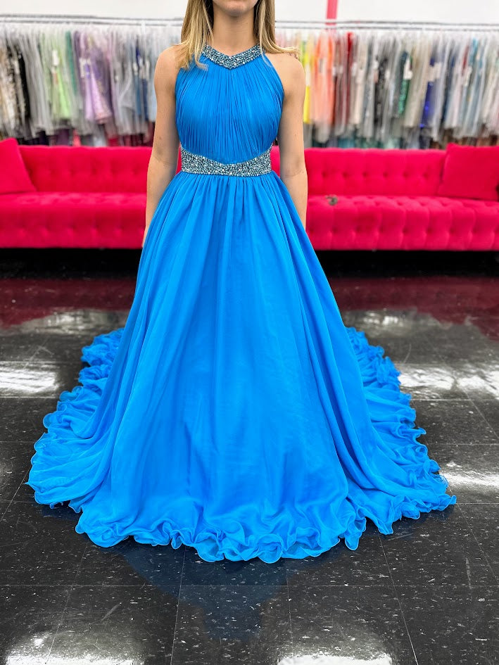 Samantha Blake 1102 Girls Pageant Dress. This stunning A Line Chiffon gown, complete with a detachable crystal Embellished cape and chiffon material, will make any young girl feel like a princess. With its train design, it offers elegance and grace for any special occasion. Get yours today and make a statement at your next Pageant.