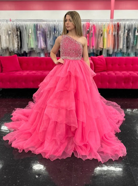 Introducing the Samantha Blake 1025 Girls Long Pageant Dress. Made with Chiffon Ruffle layers and a one shoulder design, this gown exudes elegance and sophistication. Perfect for formal events and pageants, your little girl will shine and feel like a princess in this stunning dress.&nbsp;