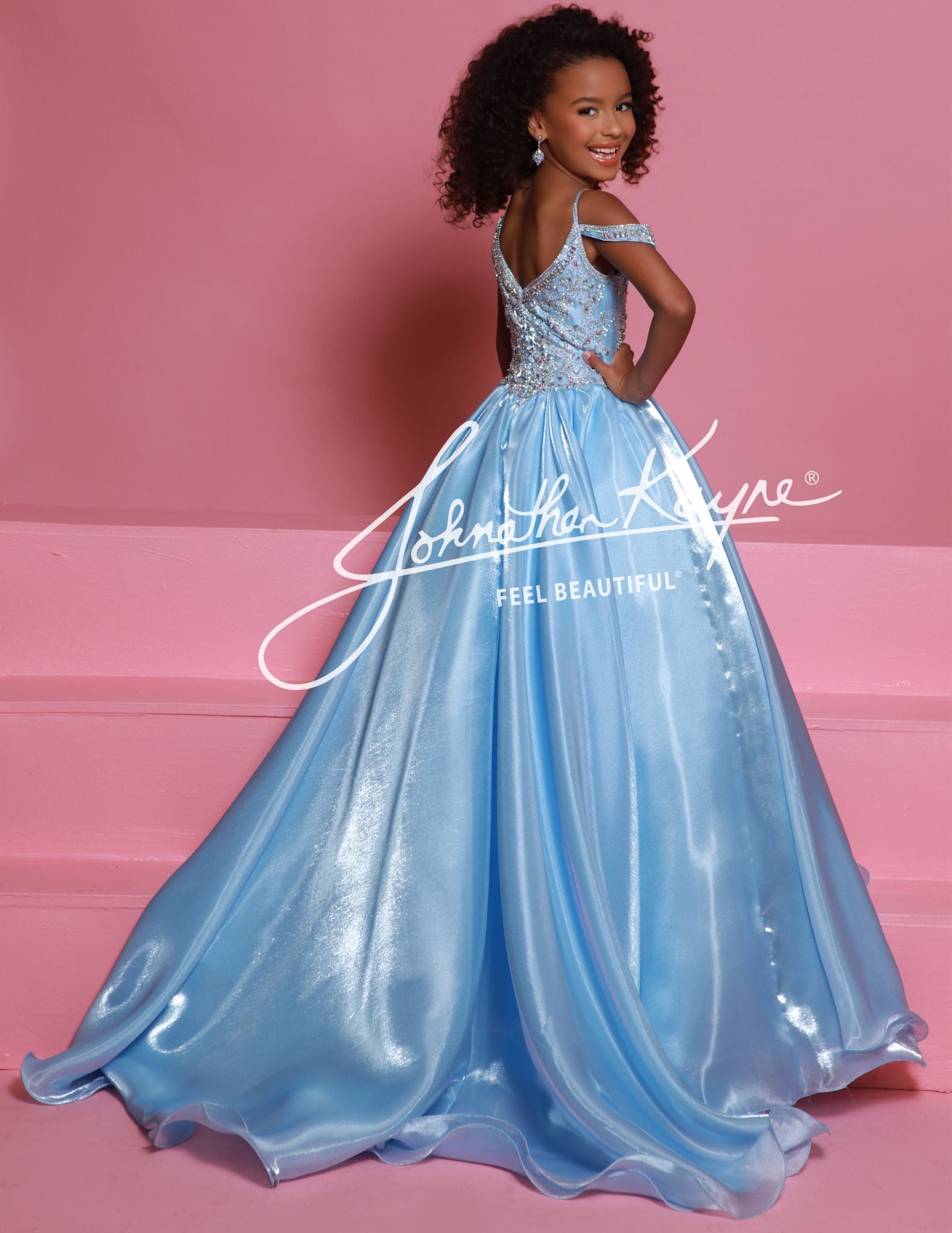 Sugar Kayne C365 Mirror Organza Girls Pageant Dress Off the Shoulder Straps Embellished BodiceElevate your child's pageant look with the Sugar Kayne C365 Organza Girls Pageant Dress. The off-the-shoulder design and crystal bodice add a touch of elegance and sparkle. Made from high-quality organza, this formal gown is not only beautiful but also comfortable for your little one to wear. Perfect for any pageant or special event.