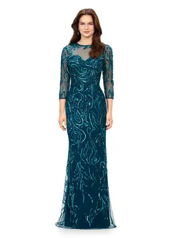 Ashley Lauren 11208 Three Quarter Sleeve Beaded Crew Neckline High Illusion Back Fully Hand Beaded Evening Gown. This gorgeous evening gown has a crew neckline, fitted mesh sleeves and a modern, intricate bead batter throughout. It is perfect for your next event.