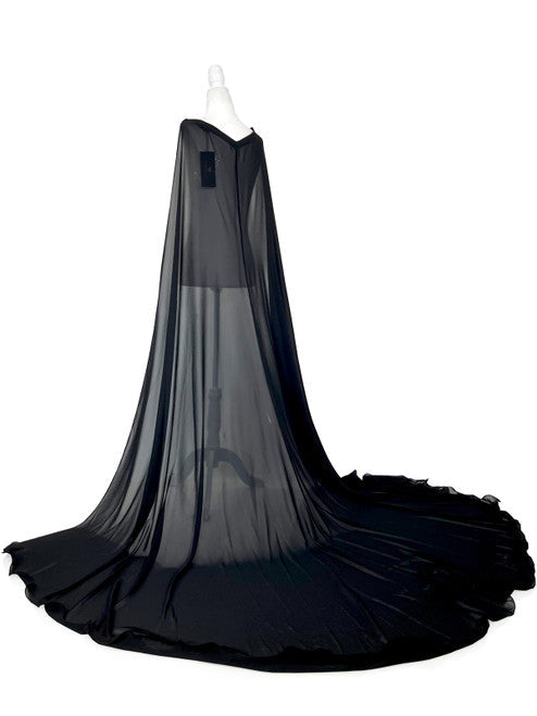 Elevate your formal look with the Marc Defang 2011 Long Chiffon Formal Pageant Cape. This detachable cape features 2 panels for a customizable fit and a stunning chiffon fabric that will flow gracefully as you move. Perfect for pageants, this cape adds that extra touch of elegance to your ensemble.   Ladies ONE SIDE FITS ALL