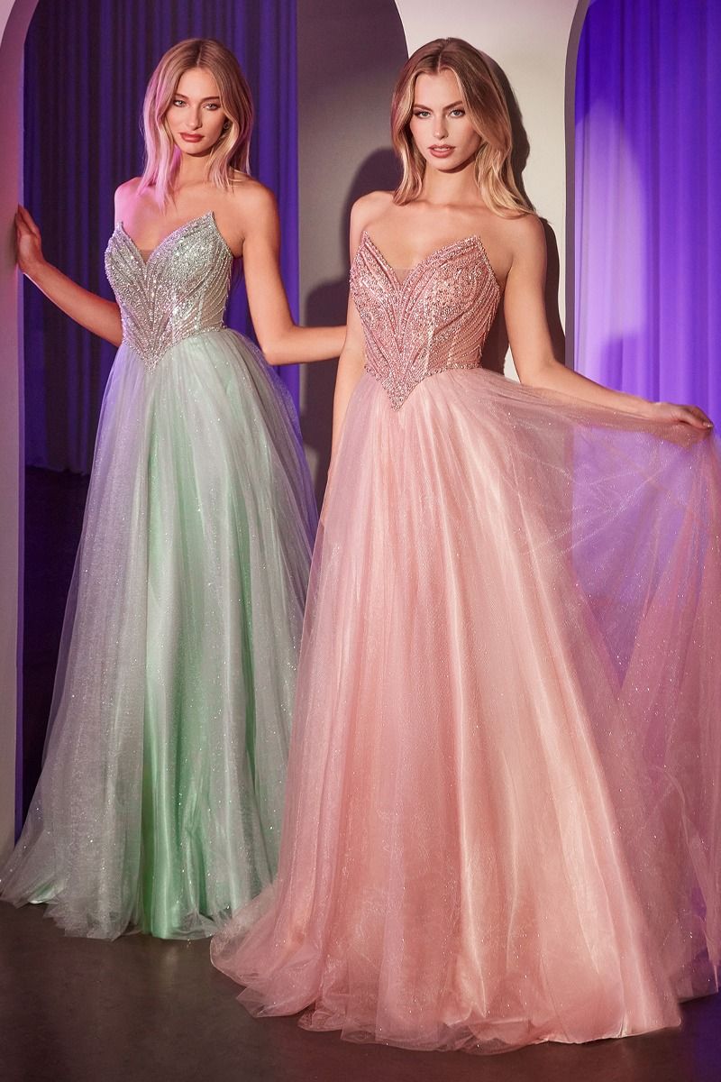 Elevate your prom look with the Ladivine CC415 V Neck Corset Prom Dress. This stunning gown features a beaded bodice and shimmering A Line skirt for a touch of glamour. The sheer neckline and corset back add a hint of sexy to this classic ballgown. Perfect for a formal occasion. Step into the spotlight in this enchanting A-line dress, featuring a pointed strapless neckline and exquisite beaded details that catch the light beautifully. The fitted bodice with a princess waistline accentuates your figure, whil