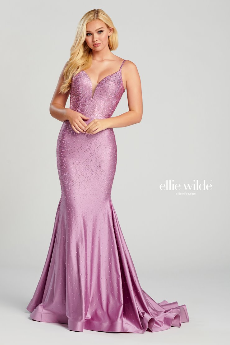 Look stunning in this Ellie Wilde EW120012 prom dress. This gorgeous mermaid-style gown has a backless crystal jersey design and sparkling crystal appliqué detailing that will make you shine on the dance floor. The fitted jersey fabric ensures that you’ll look your best in this dazzling gown. Sleeveless novelty stretch fit and flare gown with a plunging V-neck, natural waist, stone accents throughout gown, open bandeau back, horsehair hem and a sweep train.