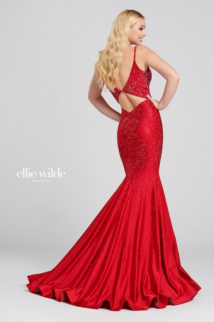 Look stunning in this Ellie Wilde EW120012 prom dress. This gorgeous mermaid-style gown has a backless crystal jersey design and sparkling crystal appliqué detailing that will make you shine on the dance floor. The fitted jersey fabric ensures that you’ll look your best in this dazzling gown. Sleeveless novelty stretch fit and flare gown with a plunging V-neck, natural waist, stone accents throughout gown, open bandeau back, horsehair hem and a sweep train.