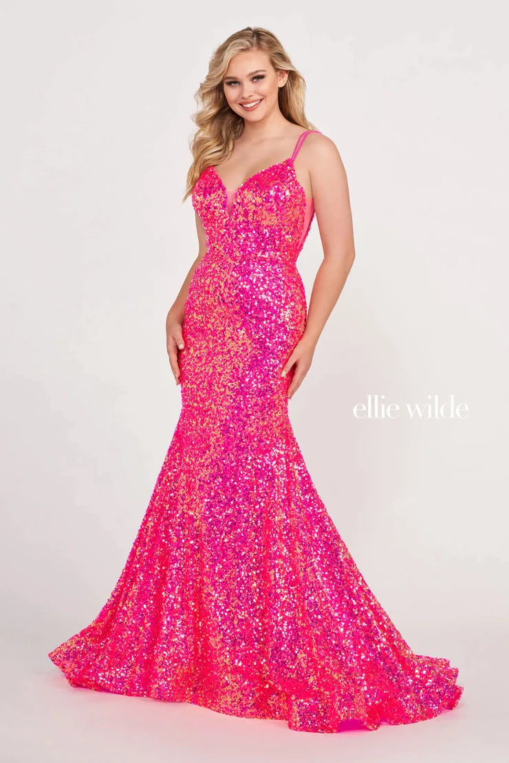 Look sophisticated and graceful in Ellie Wilde EW34016. The signature Iridescent color shifting sequins and mermaid silhouette make this timeless corset dress a perfect choice for a formal occasion. Captivate everyone in the room with its sparkling iridescent material and backless v-neckline.  Sizes: 16  Colors: FOREST LIGHT  https://dy9ihb9itgy3g.cloudfront.net/static/themes/EllieWilde/Spring_2023/EW34016.mp4