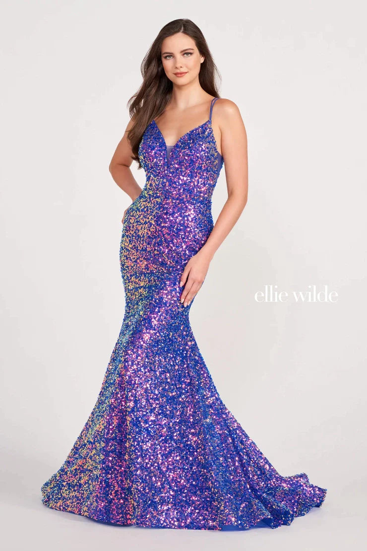 Look sophisticated and graceful in Ellie Wilde EW34016. The signature Iridescent color shifting sequins and mermaid silhouette make this timeless corset dress a perfect choice for a formal occasion. Captivate everyone in the room with its sparkling iridescent material and backless v-neckline.  Sizes: 16  Colors: FOREST LIGHT  https://dy9ihb9itgy3g.cloudfront.net/static/themes/EllieWilde/Spring_2023/EW34016.mp4