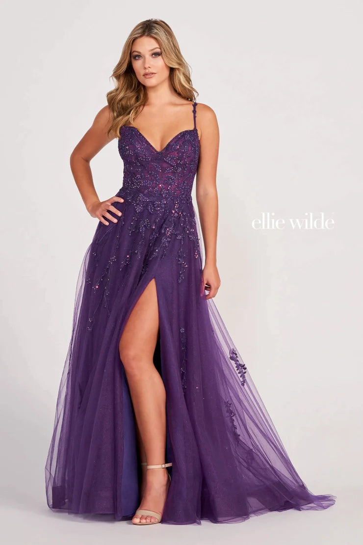 Discover a stunning combination of sheer lace shimmer and A-line silhouette with the Ellie Wilde EW34116 Prom Dress. Highlight your figure with a daring maxi slit, perfect for a formal event. This gown exudes elegance and sophistication, making you stand out amongst the crowd. Turn heads in this must-have dress.