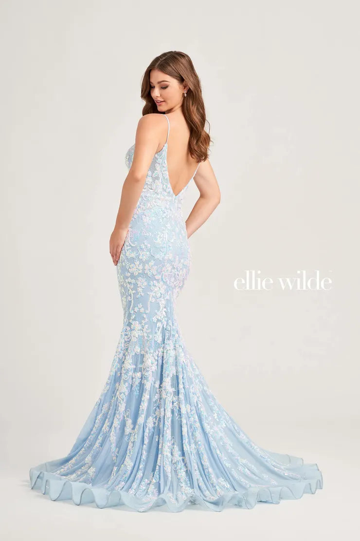 This Ellie Wilde EW35048 prom dress features a long, sheer bodice and stunning sequin detailing. The mermaid silhouette and plunging V-neckline create a flattering and glamorous look. Perfect for a formal event, this dress will make you stand out from the crowd.  Sizes: 00-16  Colors: Ice Blue, Hot Pink, Lavender, Navy Blue, Black