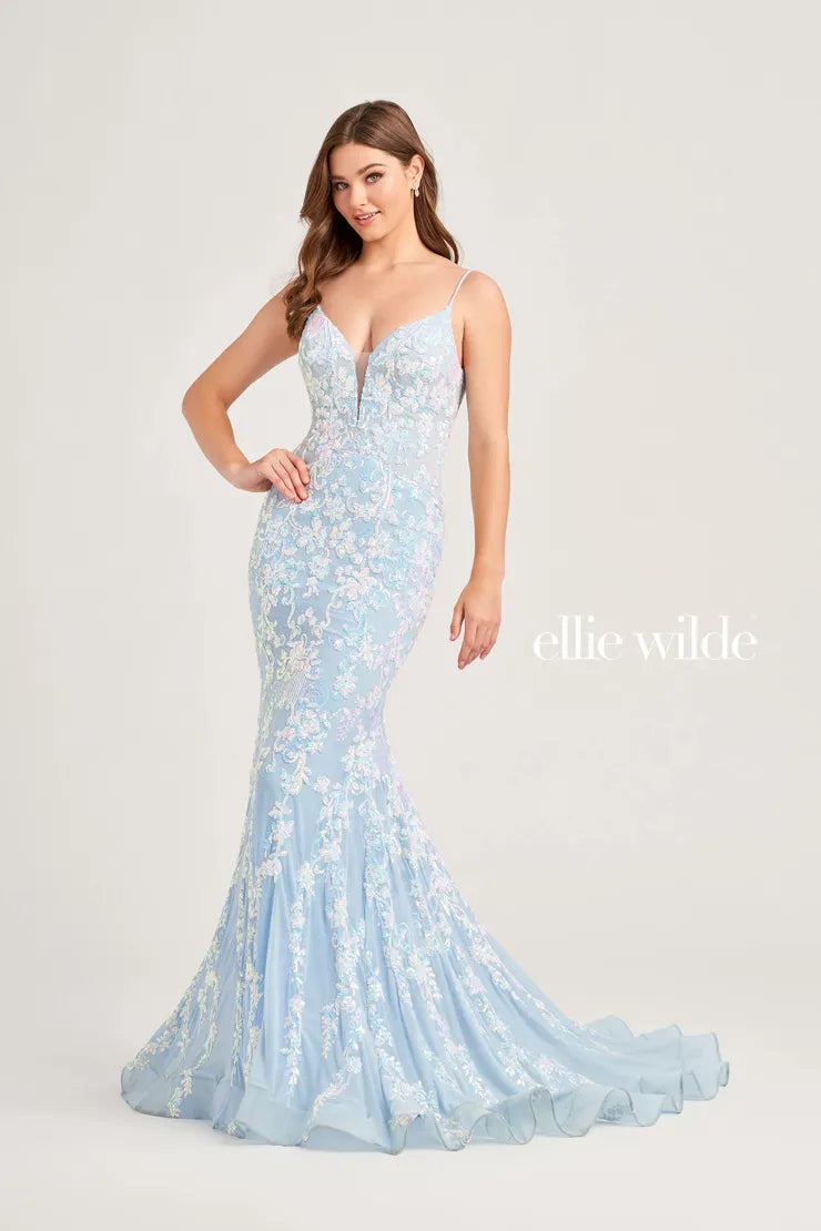 This Ellie Wilde EW35048 prom dress features a long, sheer bodice and stunning sequin detailing. The mermaid silhouette and plunging V-neckline create a flattering and glamorous look. Perfect for a formal event, this dress will make you stand out from the crowd.  Sizes: 00-16  Colors: Ice Blue, Hot Pink, Lavender, Navy Blue, Black