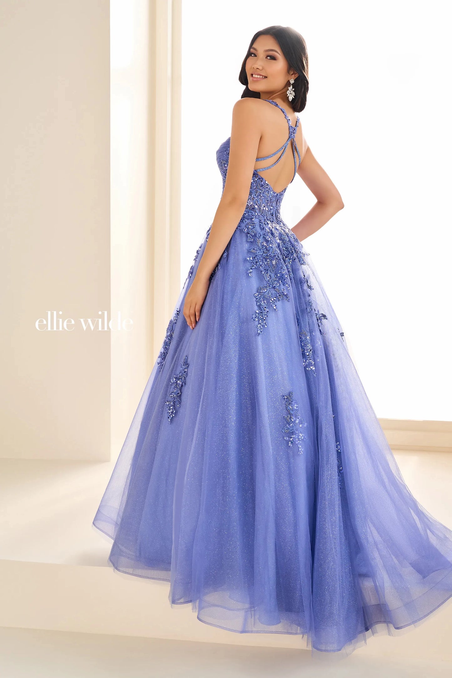 Unleash your inner glamour with the Ellie Wilde EW36202 Prom Dress. Made with shimmering sequin lace and a sheer corset, this dress is designed to make you stand out. The elegant ball gown silhouette and formal design will ensure you feel confident and sophisticated for any formal occasion.