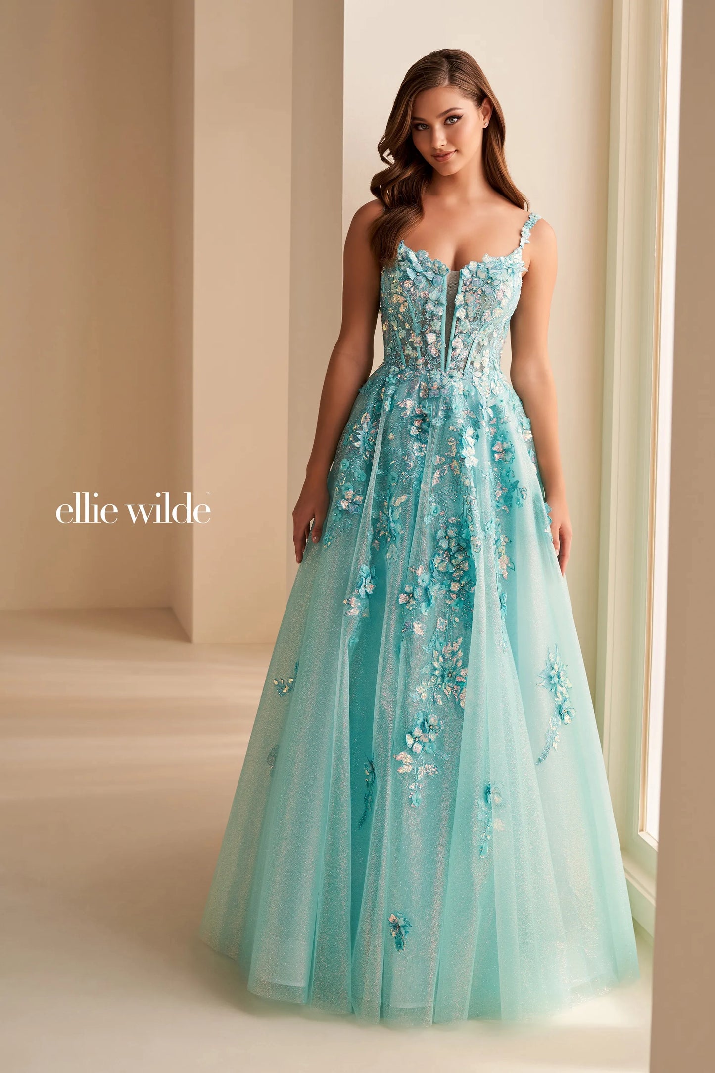 Elevate your style with the Ellie Wilde EW36213 dress. This stunning prom dress features a sheer lace corset top, Shimmer V-neckline, and A-line silhouette that will gracefully accentuate your curves. With this gown, you'll feel like a work of art, ready to make a statement at any formal event.