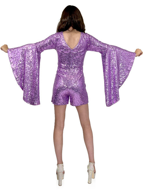 This Marc Defang 8219 Sequin Long Bell Sleeve Pageant Romper is designed with an eye-catching sequin pattern, long bell sleeves and a modern fit. It's the perfect choice for formal events, offering show-stopping style and comfort. contact us for additional colors  Sizes: 00-16  Colors: Lilac, Eggplant, Purple, Blue