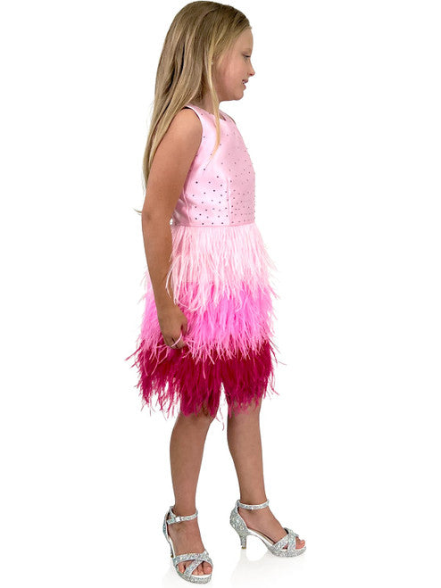 A must-have for the fashion-savvy young girl, this Marc Defang 5118 Girls Short Feather Ombre Pageant Dress features a unique, hand sewn ostrich feather all-over skirt with an ombre pattern and a beaded waistline. Embellished with hand-placed crystals along the top, this dress is fully lined and features a center back invisible zipper for a comfortable fit.  Sizes: 4,5,6,7,8,9,10,11,12,13,14  Colors: Pink, Hot Pink  *Choose Custom color from swatches! allow 25-30 days delivery