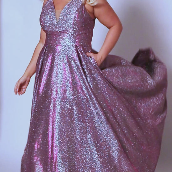 The Sydneys Closet SC7378 Long Prom Dress is perfect for plus size women who want to make a statement. With its V-neckline, A-line silhouette, and two side pockets, this formal gown is sure to turn heads. Crafted from high-quality materials for a comfortable fit, this dress is ideal for special events like proms and pageants. Look no further than our Secret Treasure plus size evening gown to look glamorous at Prom 2024 or the next formal occasion coming up on your calendar.  