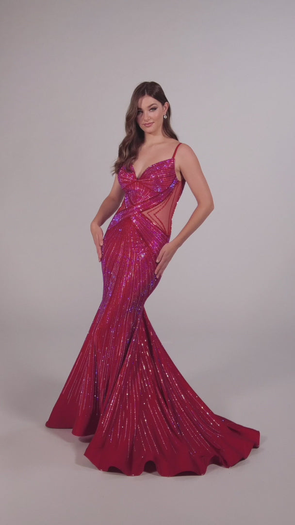 This Ellie Wilde formal dress is perfect for any prom or special event. The fitted crystal jersey construction features sheer mesh cutouts on the sides and a backless mermaid design for a perfect fit. It's finished with a low v-neck for a timeless look.  COLOR: BLACK, LIGHT BLUE, NAVY BLUE, ROYAL BLUE, HOT PINK, RUBY, IRIS, LAVENDER FROST SIZE: 00 - 20