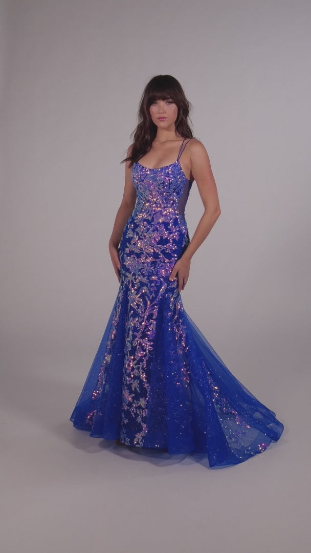 Show up in style with the Ellie Wilde EW35008 Long Sequin Shimmer Mermaid Prom Dress. Made with Glitter Sequin Tulle, this elegant gown has a Scoop Neckline, Sleeveless sleeves, Lace-Up back, and a Natural Waistline. Experience maximum comfort with the Side Waist Mesh Inset and Mermaid silhouette. Show off your curves in this figure-hugging dress!  COLOR: ORANGE, MAGENTA, ULTRA VIOLET, PERIWINKLE/OPAL SIZE: 00 - 20