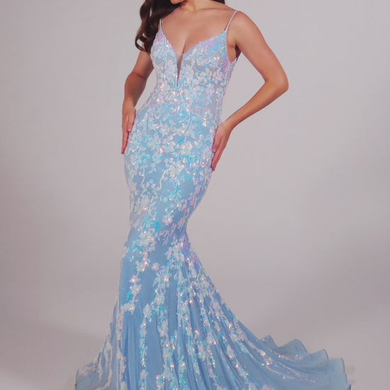 This Ellie Wilde EW35048 prom dress features a long, sheer bodice and stunning sequin detailing. The mermaid silhouette and plunging V-neckline create a flattering and glamorous look. Perfect for a formal event, this dress will make you stand out from the crowd.  Sizes: 00-16  Colors: Ice Blue, Hot Pink, Lavender, Navy Blue, Black