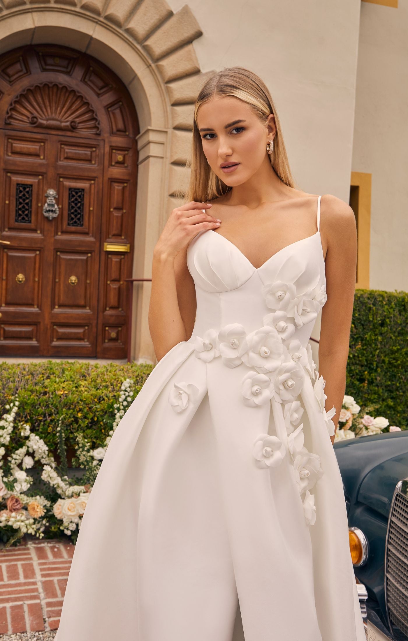 Casablanca Bridal 2556 A-Line Spaghetti Strap V-Neck Slit Train Wedding Gown. Prepare to be captivated by the sheer beauty of Style 2556 Bellisima, an exquisite A-line wedding dress that redefines effortless elegance. The spaghetti strap bodice of Bellisima features a flattering V-neckline, accentuating your décolletage and creating a delicate frame for your face.