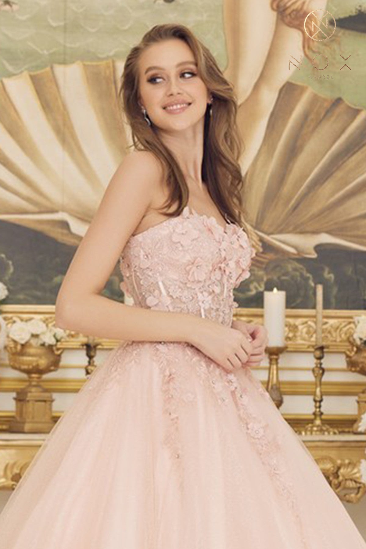 This elegant Nox Anabel CU 1194 Long #d Floral Lace Corset Ballgown Prom Dress Shimmer Formal Gown offers classic styling with a beautiful lace and shimmer fabric combination. Featuring a corset-style bodice with an ultra-flattering long flowing skirt. This dress is perfect for special occasions or proms.  Sizes: 2-16  Colors: Blush, Red