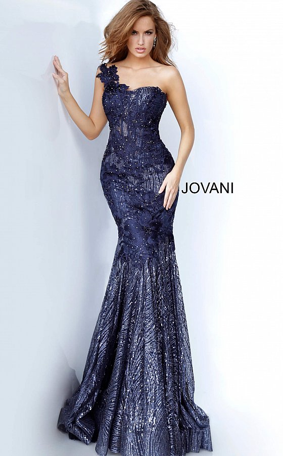 Jovani 02445 is a Navy Floral Lace embroidered and embellished lace mermaid evening gown with a one-shoulder sleeveless sheer bodice featuring corset boning and a sweetheart neckline. Floor-length fitted skirt with a flared mermaid tail end and sweeping train. Glitter & Sequin Embellished Formal Gown for Pageants, Mother Of, Red Carpet, Prom & So Much more! 