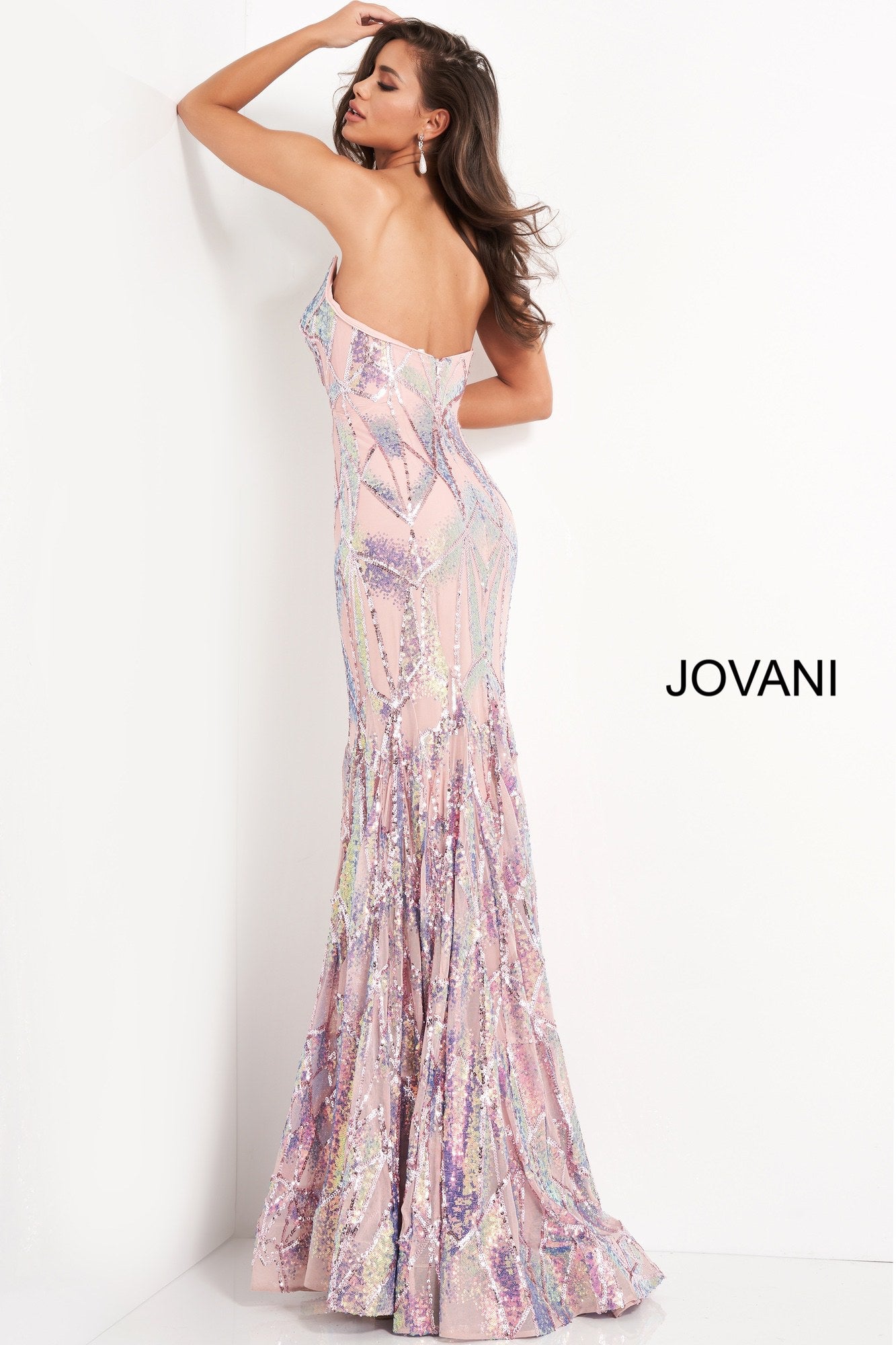 Jovani 05100 is a long Fitted formal evening gown. Featuring a strapless peak - deep sweetheart neckline. This stunning Pageant & Prom Gown is Fully Embellished with Glitter & Sequins to Create A Glamorous Geometric dimensional design. Mermaid silhouette with a lush trumpet skirt & sweeping train.  Available Sizes: 00,0,2,4,6,8,10,12,14,16,18,20,22,24  Available Colors: black/multi, light-blue, navy, pink