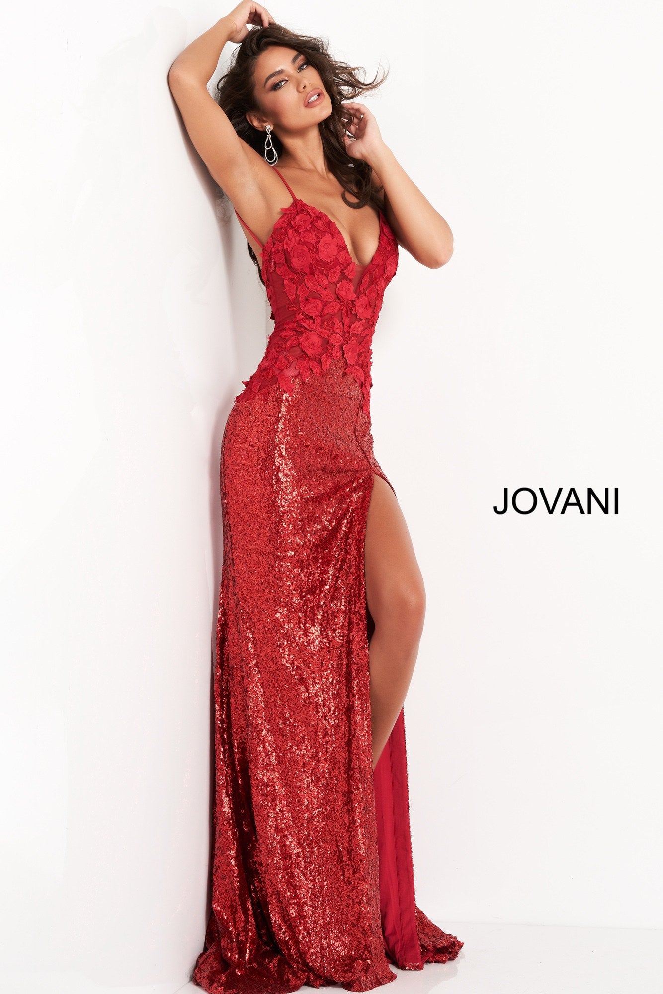 Jovani 06426 is a Long Fitted Stretch Petite Sequin Shimmering Formal Evening Gown. This Stunning Prom Dress Features a Deep V  Plunging Neckline and Detailed floral Appliques. spaghetti straps lead around to an open back. This Backless Pageant Gown throws a glamorous appeal with its lush sweeping sequin train! Sexy thigh Slit in skirt. Available Sizes: 00,0,2,4,6,8,10,12,14,16,18,20,22,24  Available Colors: Black, Cream, Red, Light Blue