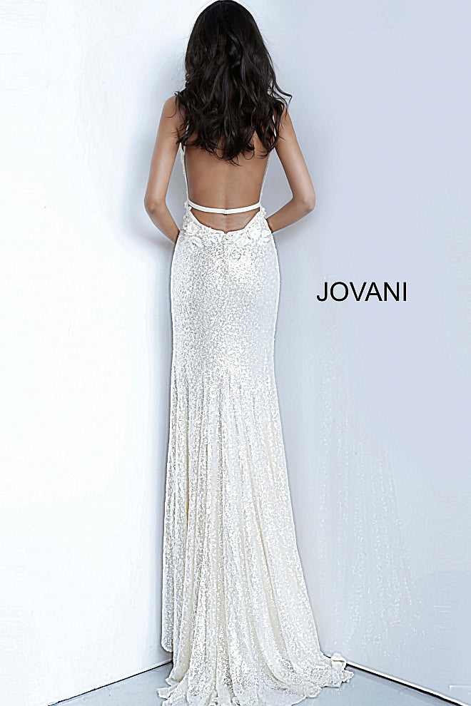 Jovani 1012 is a Delicate all over sequin Embellished Prom Dress with Floral Appliques. Features a plunging neckline & Slit in the skirt. Small Train in Back.   Details: Sequin fabric, floral appliques, fitted silhouette, high slit skirt with sweeping train, sleeveless bodice, plunging neckline with sheer mesh insert, low back with strap across for support, spaghetti straps over shoulders.