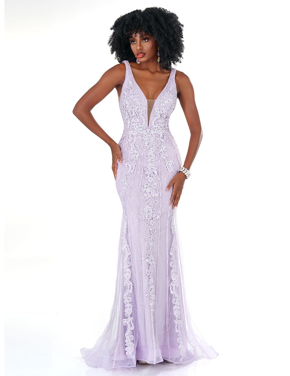 Experience the elegance of this lip-pleated "Cecilia Couture 1570" evening gown made from a high-quality sequin-sparkle fabric. It is a long fitted dress with a V-neck design, featuring a lace-embellished bodice and ruched waistline. It is perfect for your next special event!  Sizes: 0-20  Colors: Lilac, Champagne