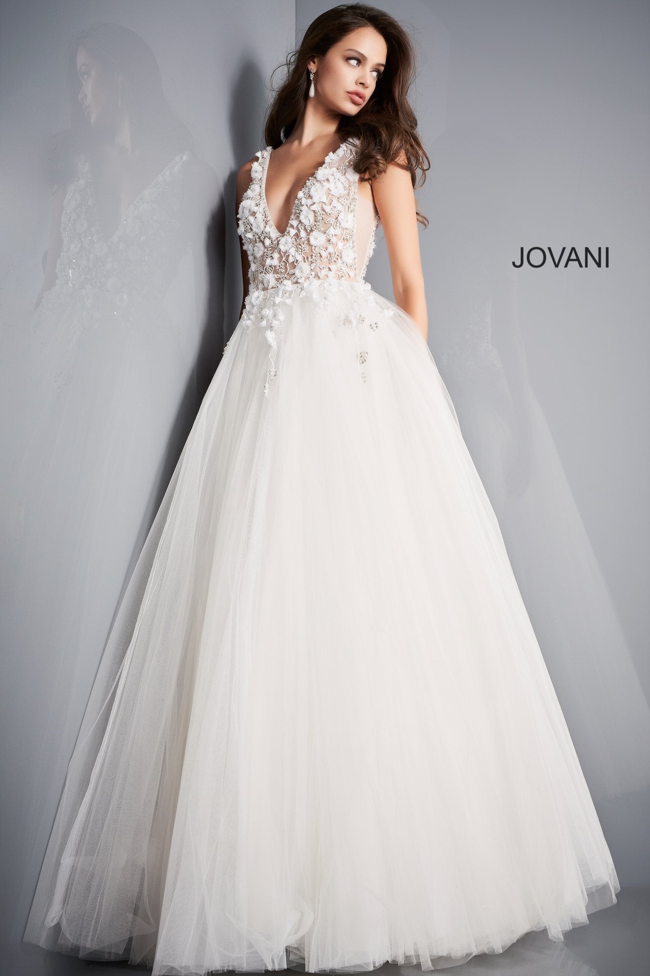 Jovani 3110 is a stunning tulle ball gown Prom Dress. Embellished 3D Floral Appliques on Sheer Illusion Bodice. Deep V Neckline & Back.  This gown would be a Perfect Sexy Wedding Dress In Ivory!  Available Sizes: 00, 0, 2, 4, 6, 8, 10, 12, 14, 16, 18, 20, 22, 24  Available Colors: blue, ivory, red