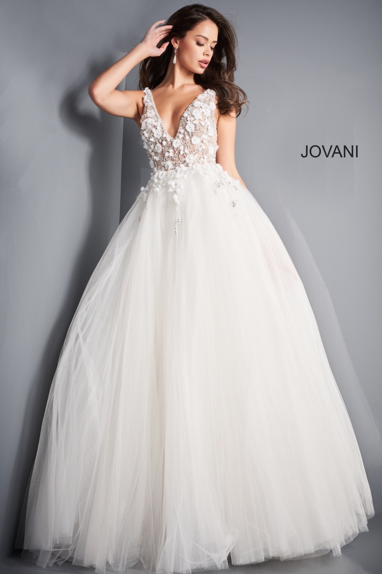 Jovani 3110 is a stunning tulle ball gown Prom Dress. Embellished 3D Floral Appliques on Sheer Illusion Bodice. Deep V Neckline & Back.  This gown would be a Perfect Sexy Wedding Dress In Ivory!  Available Sizes: 00, 0, 2, 4, 6, 8, 10, 12, 14, 16, 18, 20, 22, 24  Available Colors: blue, ivory, red