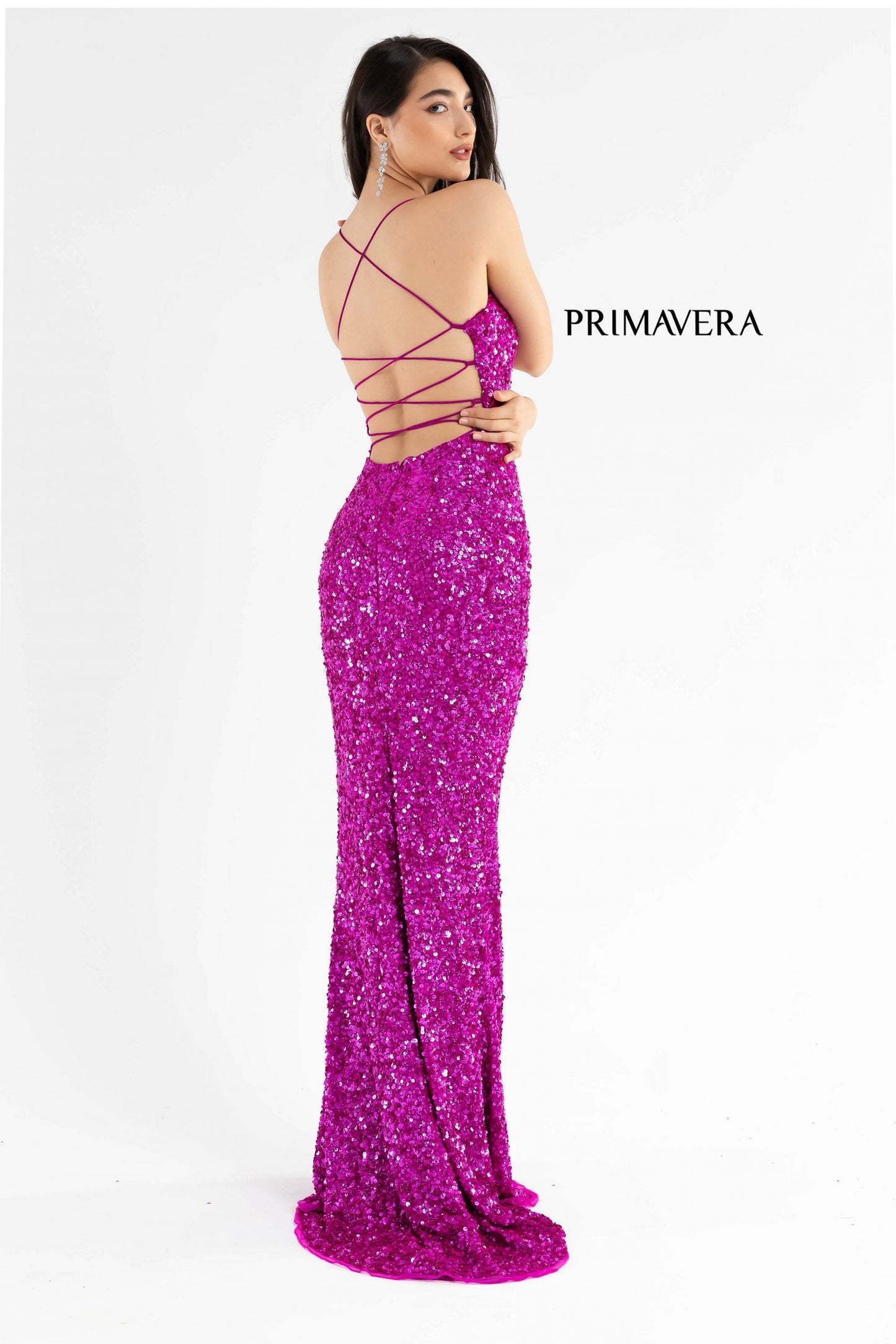 Primavera Couture 3290 This prom dress adds a pop to the multi sequins dress.  With a scoop neckline and spaghetti straps that cross and tie in the back.  This long evening dress has a side slit. 