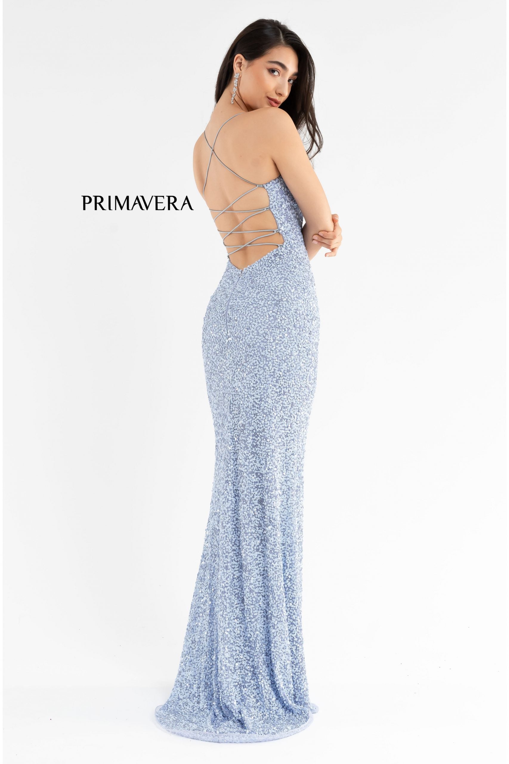 Primavera Couture 3290 This prom dress adds a pop to the multi sequins dress.  With a scoop neckline and spaghetti straps that cross and tie in the back.  This long evening dress has a side slit. 