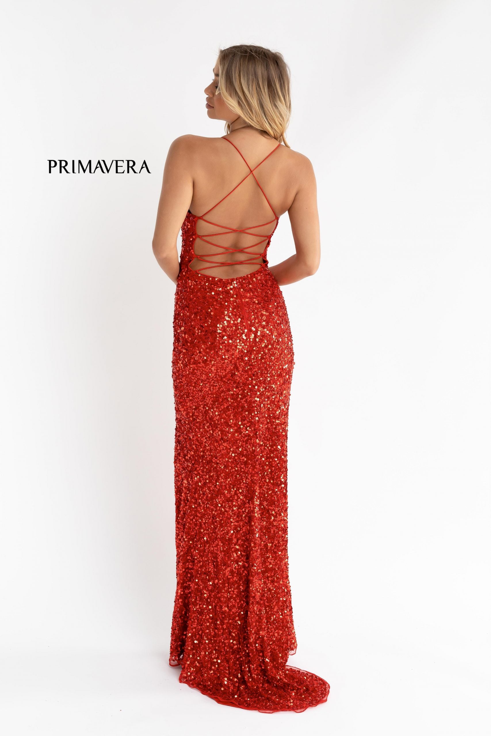 Primavera Couture 3290 This prom dress adds a pop to the multi sequins dress.  With a scoop neckline and spaghetti straps that cross and tie in the back.  This long evening dress has a side slit.  Available sizes:  000, 00, 0, 2, 4, 6, 8, 10, 12, 14, 16