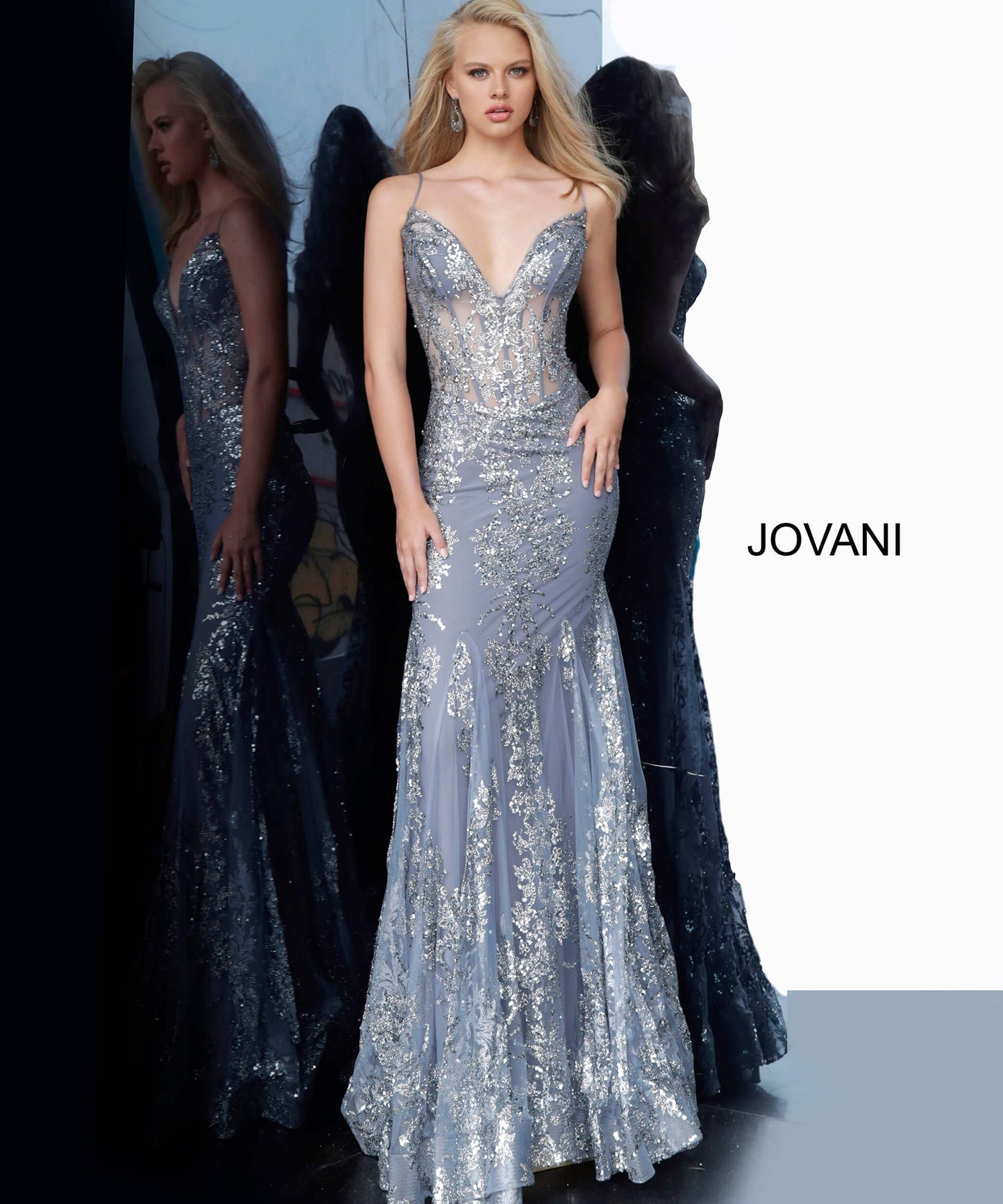 Shine like a Diamond in Jovani 3675! This Gown Features an Embellished Sheer Corset Style Bodice with a Deep V Neckline. Mermaid Silhouette with a Glitter & Crystal Overlay on Tulle. 