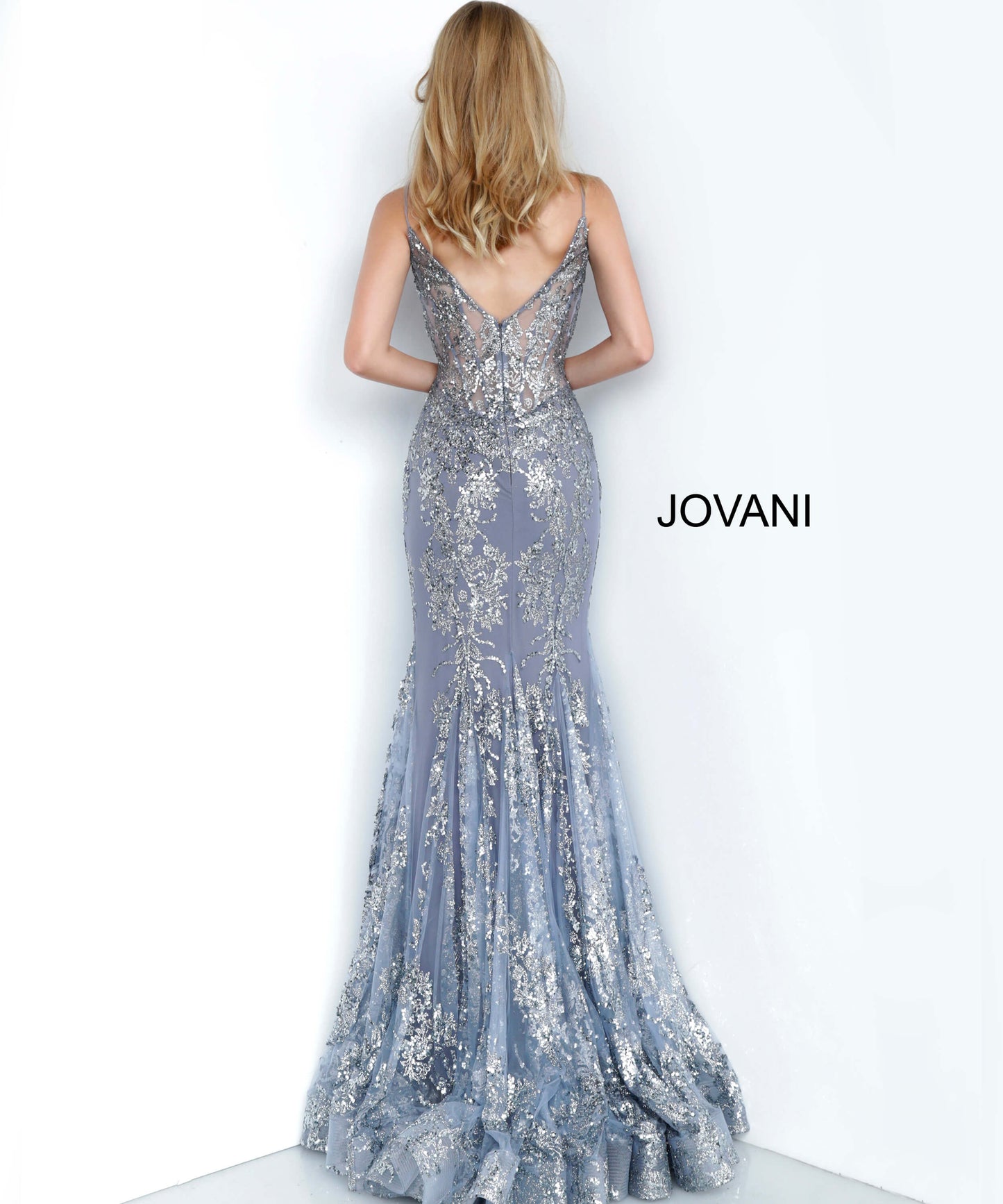 Shine like a Diamond in Jovani 3675! This Gown Features an Embellished Sheer Corset Style Bodice with a Deep V Neckline. Mermaid Silhouette with a Glitter & Crystal Overlay on Tulle. 