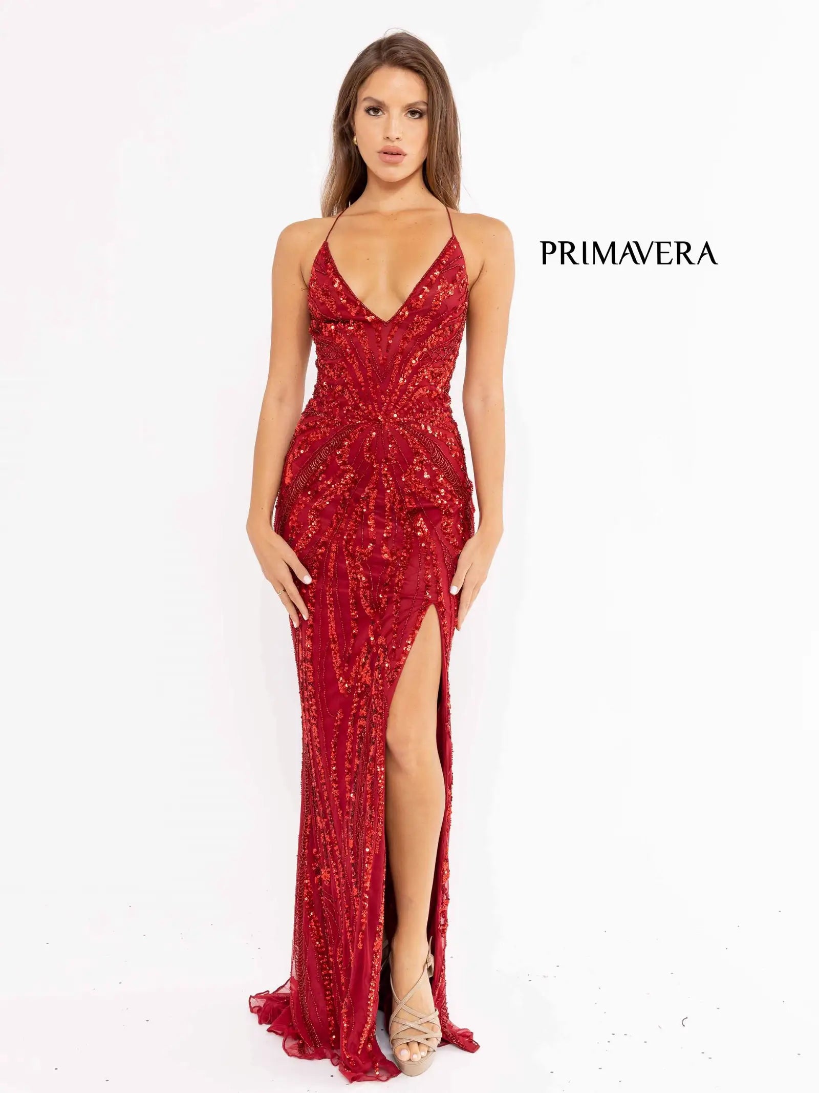 Primavera Couture 3958 Prom Dress Long beaded Gown. Its has a slit and a beautiful design on the gown.