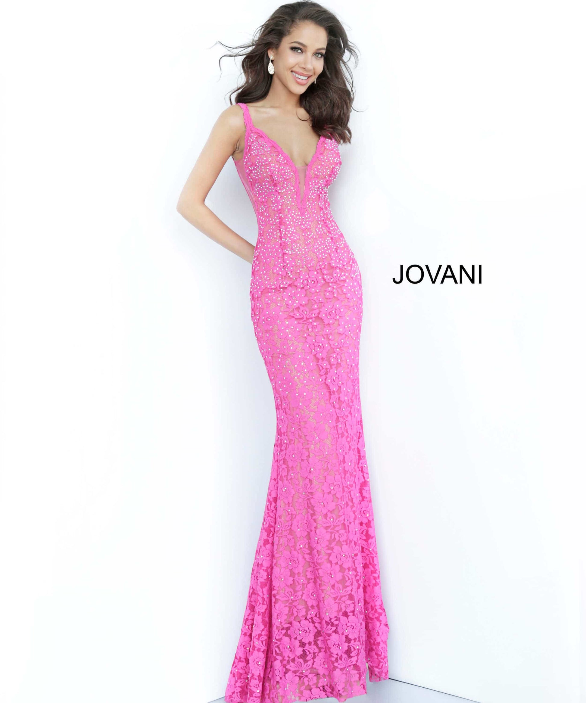 Jovani 48994 Stretch lace prom dress embellished with heat set stones, nude underlay, fitted silhouette, straps over shoulders, plunging v neck with sheer mesh, sheer mesh inserts along the sides, sweeping train, low v back. Makes an excellent pageant evening gown.   Available colors:  black, bright pink, emerald, fuchsia, grey, light-blue, light-pink, lilac, navy, peach, periwinkle, red, white