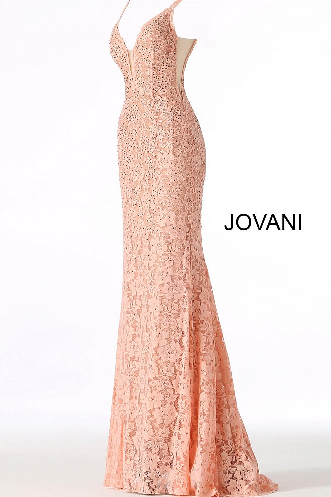 Jovani 48994 Stretch lace prom dress embellished with heat set stones, nude underlay, fitted silhouette, straps over shoulders, plunging v neckline with sheer mesh, sheer mesh inserts along the sides, sweeping train, low v back. Makes an excellent pageant gown or evening gown. 